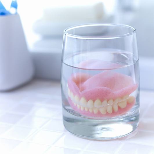 two sets of full dentures and two partials