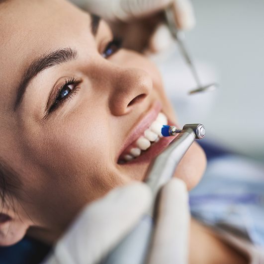 a patient undergoing a dental cleaning in Barnegat