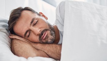 Man sleeping in bed