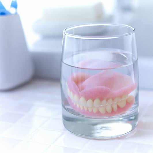 Senior woman smiling with dentures