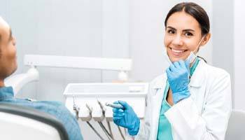 dentist smiling toward the camera