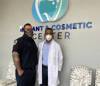 Dr. Gizachew and patient wearing masks