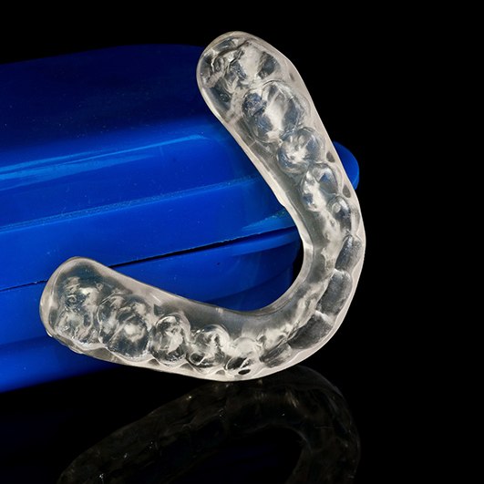 Close-up of nightguard leaning on case