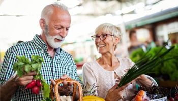 older couple shopping for healthy food