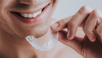 closeup of person holding mouthguard