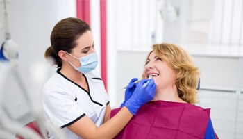 woman visiting dentist for checkup 