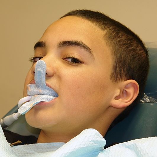 Young patient receiving fluoride treatment