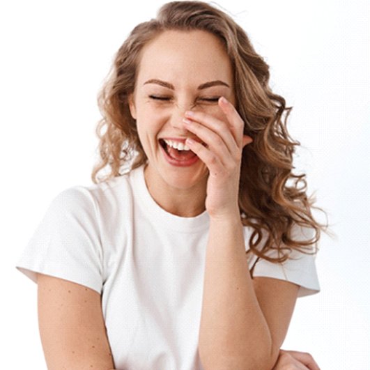 woman laughing after getting teeth whitening in Barnegat