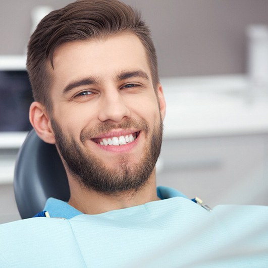 Young man smiling after wisdom tooth removal in Brick Township, NJ