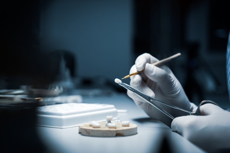 Dental technician working on some dental crowns