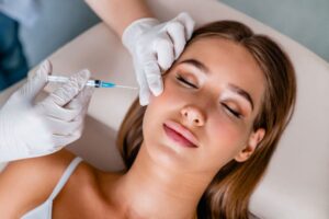 Woman receiving BOTOX injection in her jaw